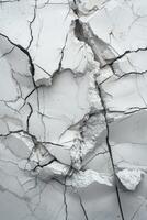 Top view photo of a solid color ground showing a large collapsed area from a strong impact, with cracks radiating outward