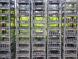 Stacked boxes on top of each other. Seedling boxes. Empty containers photo