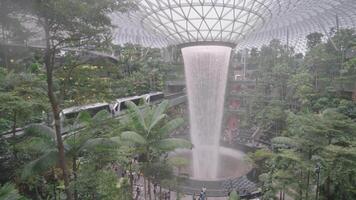 Singapore, Singapore - May 3, 2024 - The Jewel Rain Vortex, the largest indoor waterfall and main attraction at Changi Airport, Singapore, designed by Moshe Safdie. video