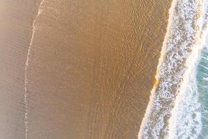 shore of a beach at low tide, aerial directly above view with a drone. Summer concept photo