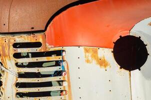 detail of the front part of an old retro car in a scrapyard photo
