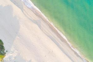 Aerial top view at the beach from a drone. Beautiful natural seascape at the summer photo