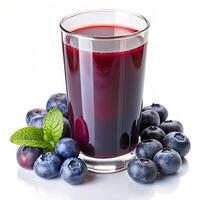 Glass of Blueberry Juice Surrounded by Blueberries photo