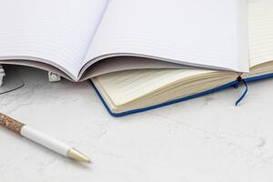 The pen lies in the notebook, the concept of study, time management. photo