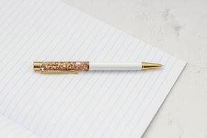 The pen lies in the notebook, the concept of study, time management. photo