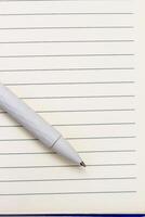 The pen lies in the notebook, the concept of study, time management. photo