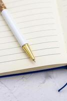 The pen lies in the notebook, the concept of study, time management. photo