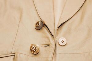 Decoration on the texture of a brown leather jacket, genuine soft leather photo