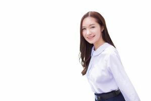 Asian high school student in the school uniform with braces on her teeth stands and smiles confidently while she looks at the camera happily with the city while isolated white background. photo