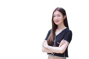 A long-haired Asian professional businesswoman in a black shirt is smiling happily in the early morning hours of the day. photo