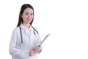 Professional young woman doctor holding document in clipboard smiling looking at camera while she wears white lab coat and stethoscope in hospital while isolated white background. photo