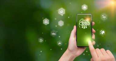 CO2 emission reduction concept.world icon in hand with environmental icons, Ideas for Sustainable development, and green business based on renewable energy. Energy saving, Sustainable development. photo