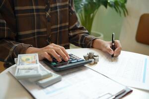 Saving money. Businessman Accountant verify growing business and saving money stacking coins with calculator. Accountancy Concept photo