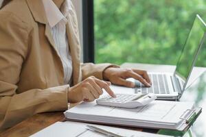 Calculating Cost Economic budget saving and investment concept analyzing investment charts and calculator Accounting Concept photo