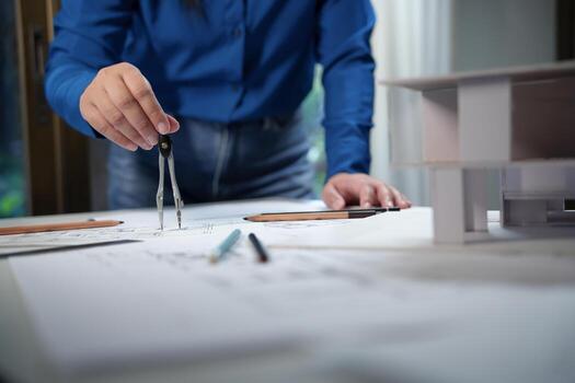 Architecture drawing on architectural project business architecture building construction Colleagues designer Planning Design on blueprint with compasses photo