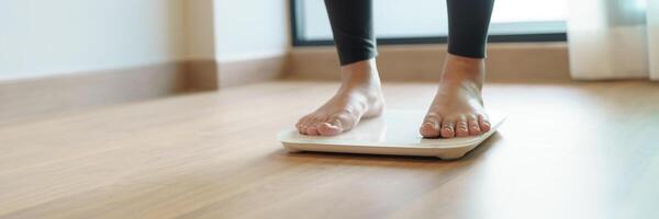 Lose weight. Fat diet and scale feet standing on electronic scales for weight control. Measurement instrument in kilogram for diet. photo