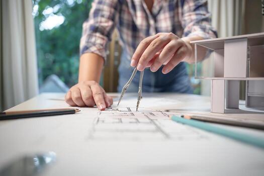 Architecture drawing on architectural project business architecture building construction Colleagues designer Planning Design on blueprint with compasses photo