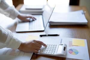 Calculating Cost Economic budget saving and investment concept analyzing investment charts and calculator Accounting Concept photo