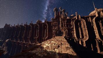 A very tall building with a sky full of stars in the background photo