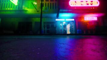 A building with neon lights on the side of it photo