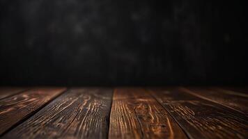 Empty dark wooden table top or surface on blurred black background. Banner with copy space. Template showcase scene for display, montage, advertising product. photo