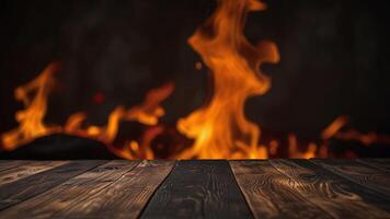 Empty dark textured wooden surface on blurred background with burning fire. Banner with copy space. Template showcase scene for display, montage, advertising product. photo