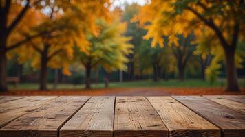 Empty wooden surface on blurred seasonal autumn background. Nature with view to park trees. Mock up with copy space. Template showcase scene for display, montage, advertising product. photo
