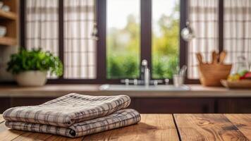 Wooden countertop with tablecloth on blurred modern kitchen interior background. Mock up with copy space. Template showcase scene for display, montage, advertising product photo