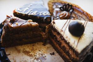 Different pieces of cake. A sweet snack. Assorted cakes. photo
