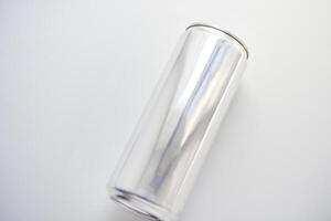A silver tin can on a white background. A juice can. Aluminum containers. photo