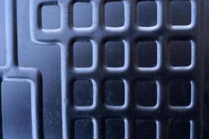 Shiny metal surface. The shiny radiator of an old refrigerator. photo