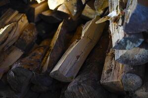 There's firewood in the closet. Stacked firewood. Storage of firewood. photo