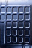 Shiny metal surface. The shiny radiator of an old refrigerator. photo