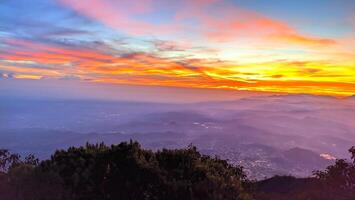 morning sunrise light at the top of Mount Slamet with a background of colorful sky light patterns photo