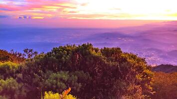 morning sunrise light at the top of Mount Slamet with a background of colorful sky light patterns photo