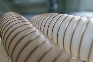 Flexible PUR antistatic suction hose for air conditioning, background flexi hose, industrial ventilation photo