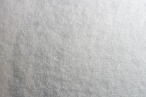 White artificial foam, foam texture on a light background. photo