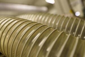 Flexible PUR antistatic suction hose for air conditioning, background flexi hose, industrial ventilation photo