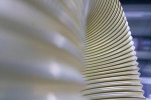 Flexible PUR antistatic suction hose for air conditioning, background flexi hose, industrial ventilation photo