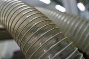 Flexible PUR antistatic suction hose for air conditioning, background flexi hose, industrial ventilation photo