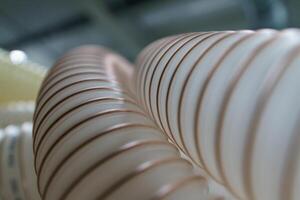 Flexible PUR antistatic suction hose for air conditioning, background flexi hose, industrial ventilation photo