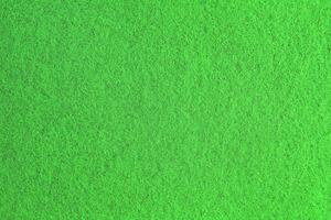 Green background pattern and texture of colored felt board. photo