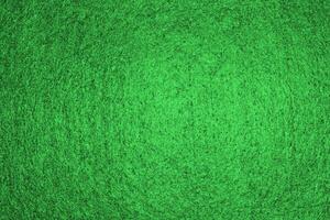Green background pattern and texture of colored felt board. photo