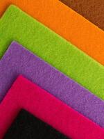 Colorful background pattern and texture of colored felt board. photo