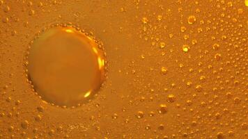 Cooking oil, water with oil emulsions and bubbles in the background. photo