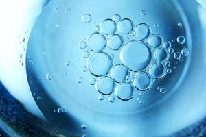 Blue bubbles and drops of water in the background. photo