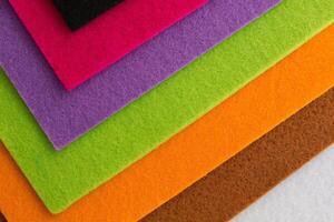 Colorful background pattern and texture of colored felt board. photo