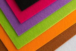 Colorful background pattern and texture of colored felt board. photo