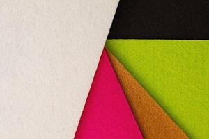 Colorful background pattern and texture of colored felt board. photo