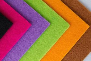 Colorful background pattern and texture of colored felt board. photo